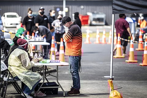 People visit a pop-up vaccination site, Tuesday, Oct. 19, 2021, in suburban Auckland, New Zealand. (Photo | AP)