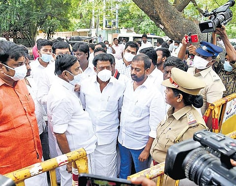 Police stop AIADMK cadre as they try to enter C Vijayabaskar’s residence at Kilpauk during the DVAC raids on Monday | R Satish Babu
