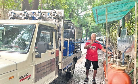 Alag Natarajan filling the matkas from his water tanker
