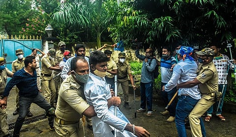 Police arrest NSUI activists while they attempt to hurl eggs at Minister of State for Home Dibya Shankar Mishra’s residence in Bhubaneswar. (Photo | Express)