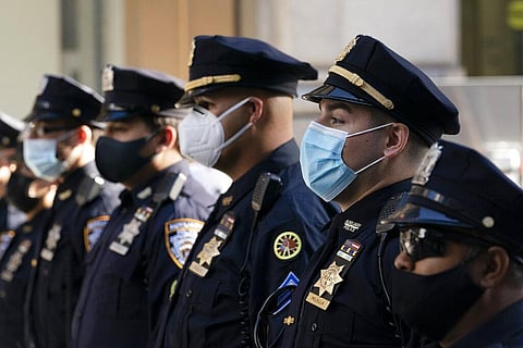 NYPD officers in masks stand during a service at St. Patrick's Cathedral in New York to honor 46 colleagues who have died due to COVID-19 related illness. (Photo | AP)