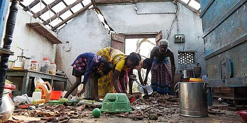 People salvaging their belongings following cyclone Gaja.