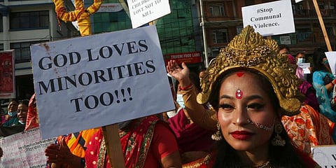 Members of ISKCON (International Society for Krishna Consciousness) participate in a peaceful protest against the recent violence against Hindus in Bangladesh. (Photo | AP)