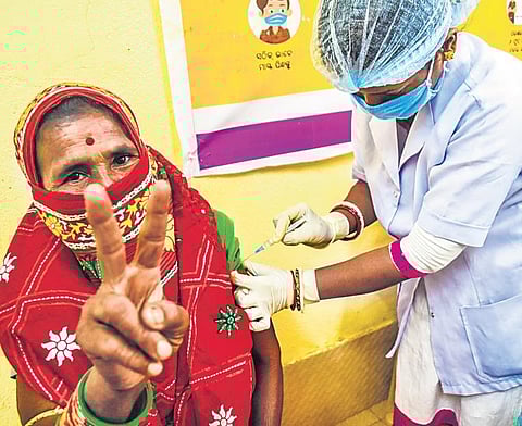 A health worker administers Covid-19 vaccine to a woman at Unit-4 UPHC in Bhubaneswar on Thursday | Express