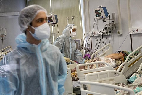 Medical staff in special suits treat a COVID-19 patient at an ICU in Infectious Hospital No. 23 in Nizhny Novgorod, Russia, on Wednesday, Oct. 20, 2021. (Photo | AP)