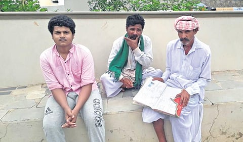 (Above) A group of Helavaru during a visit to Gadag town earlier this month (Left) A writing maintained by Balappa Helavaru | Express