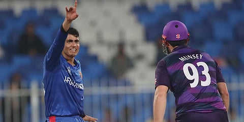 Afghanistan's Mujeeb Ur Rahman successfully appeals the dismissal of Scotland's Richie Berrington during a T20 World Cup match in Sharjah. (Photo| ANI)