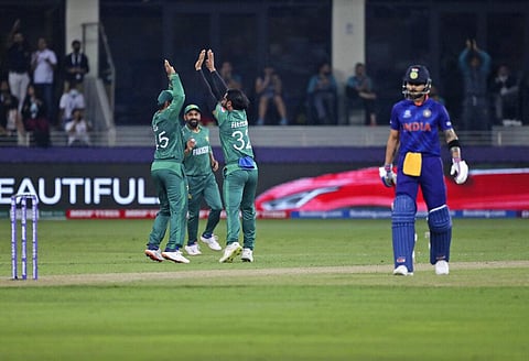 Pakistan's Hasan Ali, third left, celebrates the dismissal of India's Suryakumar Yadav. (Photo | AP)