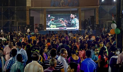 Cricket fans watch the World Cup T20 match of India and Pakistan, on a big screen, in Kolkata. (Photo | PTI)