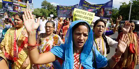 Followers of the International Society for Krishna Consciousness protest against the recent violence against Hindus in Bangladesh. (Photo | AP)
