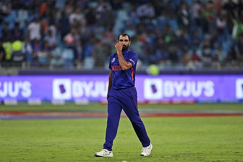 India's Mohammed Shami reacts after he was hit by three consecutive boundaries during the Cricket Twenty20 World Cup match between India and Pakistan in Dubai. (Photo | AP)