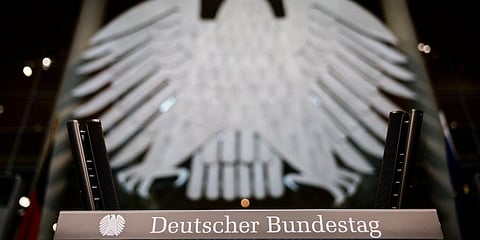 German heraldic eagle is displayed over the lectern of the German Parliament Bundestag in the Reichstag building in Berlin. (Photo | AP)