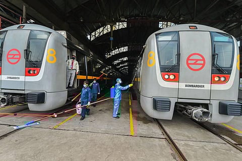 A worker sanitises a metro coach as Delhi Metro Rail Corporation DMRC. (Representational Photo | PTI)