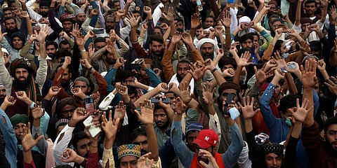 Supporters of radical Islamist party Tehreek-e-Labiak Pakistan chant religious slogans during a protest march towards Islamabad, in Mureedke. (Photo| AP)
