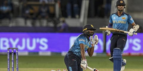 Sri Lanka's Bhanuka Rajapaksa (L) hits a boundary during a T20 World Cupmatch against Australia in Dubai. (Photo| AFP)