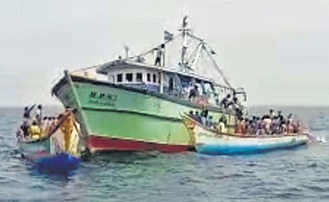 Small fishermen rounding up a trawler vessel that allegedly damaged their nets | special arrangement