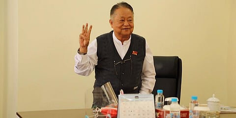 Former Burmese soldier Win Htein flashes the three-finger protest gesture as a symbol of defiance in Naypyitaw. (File photo| AP)