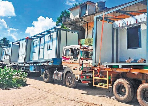 Trucks carrying prefabricated structures for the hospital from Chennai to Nischintakoili. (Photo | EPS)