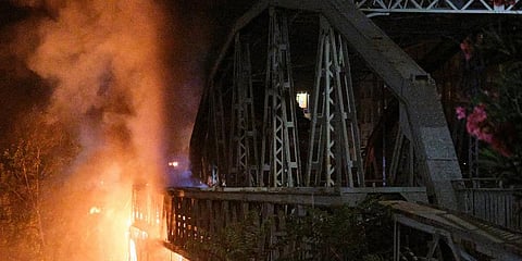 Flames engulf the Industry Bridge in Rome. (Photo | AP)