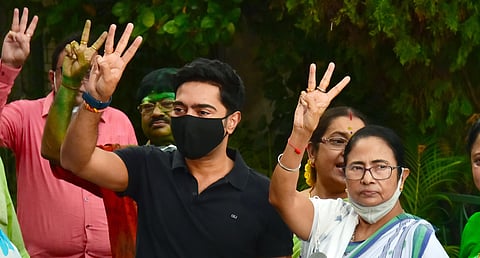 West Bengal Chief Minister Mamata Banerjee along with others showing three fingers to symbolise winning Bhowanipore seat the three times. (Photo | ANI)