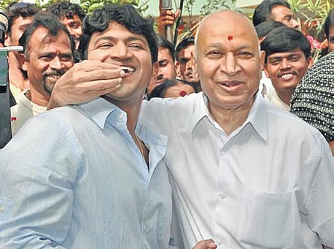 Director KM Chaitanya with late actor Puneeth Rajkumar