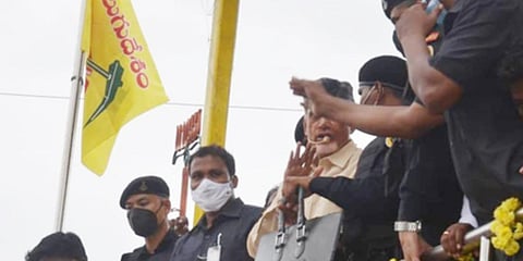 TDP chief N Chandrababu Naidu being guarded by security staff during his roadshow in Kuppam. (Photo | EPS)