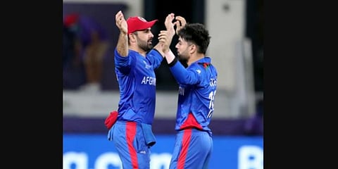 Afghanistan’s Rashid Khan and captain Mohammad Nabi celebrates a dismissal. (Photo | ANI)
