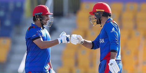 Afghanistan's Asghar Afghan, left, gestures to teammate Mohammad Nabi during the Cricket Twenty20 World Cup match between Afghanistan and Namibia in Abu Dhabi, UAE, Sunday, Oct. 31, 2021. (Photo | AP)