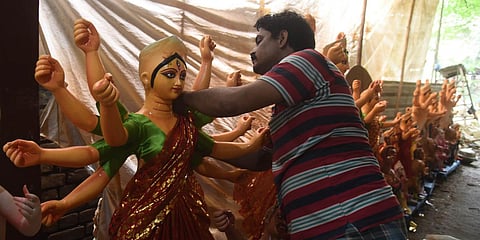 An artist seen preparing durga idols for the upcoming Durga Festival at the CR park. (Photo| Parveen Negi, EPS)