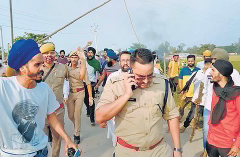 Agitated farmers take to streets after protesters were run over by SUVs in Uttar Pradesh’s Lakhimpur Kheri on Sunday. (Photo | PTI)