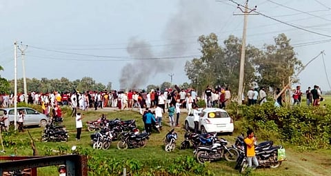 A vehicle set ablaze after violence broke out after farmers agitating were allegedly run over by a vehicle in the convoy of a union minister. (Photo | PTI)