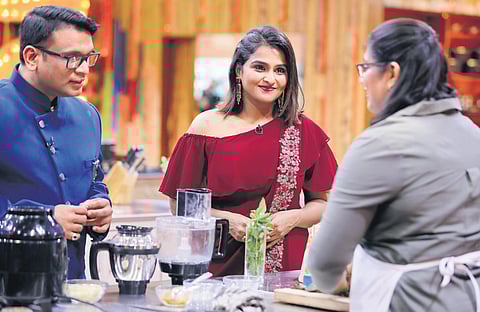 Chef Harish Rao and Ramya Nabeesan with a contestant.