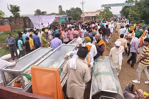 Farmers with mortal remains of their family members who were killed in yesterday's violence in Lakhimpur Kheri, Monday, Oct. 4, 2021. (Photo | PTI)