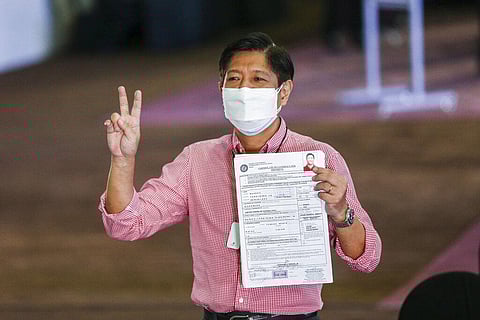 Former senator Ferdinand 'Bongbong' Marcos Jr. poses after filing his certificate of candidacy for next year's presidential elections in Manila on Wednesday. (Photo | AP)