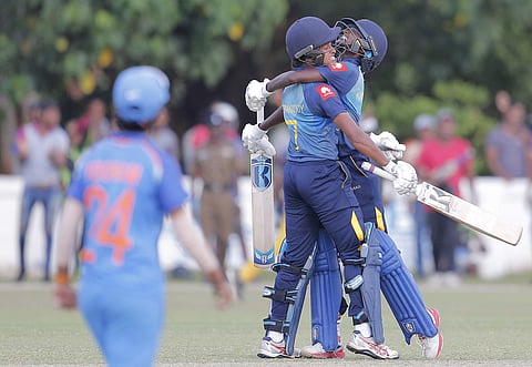 Sri Lanka's Kavisha Dilhari, right, and Sripali Weerakkody celebrate their victory over India by three wickets in the third women's ODI match. (File | AP)