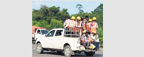 Migrant labourers being ferried in goods vehicles to work sites in Paradip. (Photo | Express)