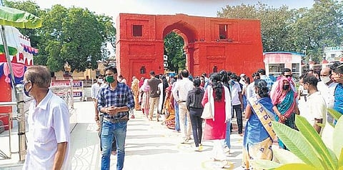 Devotees enter Samaleswari temple in queues on occasion of Mahalaya. (Photo | Express)