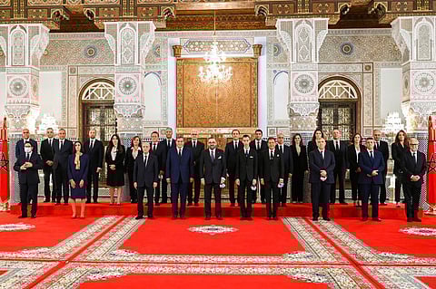 In this photo released by the Royal Palace, front row Morocco's King Mohammed VI, center,   poses with all members of the new government of Morocco. (Photo | AP)
