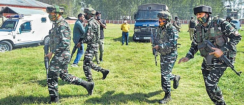Security personnel arrive at Government Boys Higher Secondary School after militants shot dead two teachers, including a woman, at Eidgah Sangam area of Srinagar on Thursday | PTI