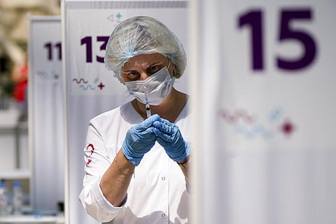 A medical worker prepares an injection of Russia's Sputnik V coronavirus vaccine at a vaccination center in Moscow. (Photo | AP)