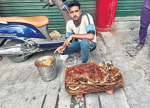 An apiarist selling honey in Landour, Uttarakhand.