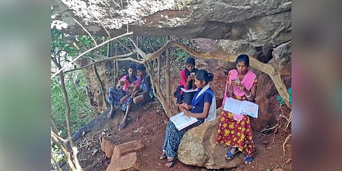A file photo of students from a tribal settlement on Pachamalai Hill struggling to find tower signal so they could access their online classes | Express