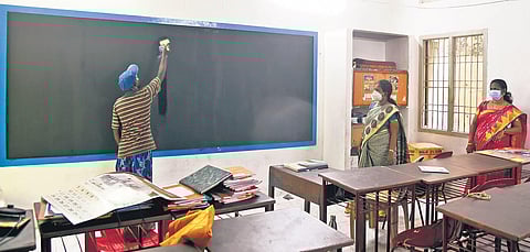 With classes 1 to 8 reopening today, a worker painting the blackboard at CSI Middle school in Chennai. (Photo | EPS/Martin louis)