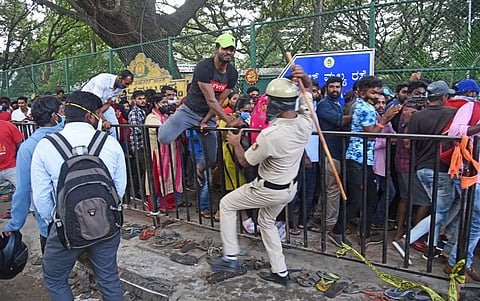 Cops resort to mild lathicharge to control the crowd outside Kanteerava Stadium. (Photo | Vinod Kumar, EPS)