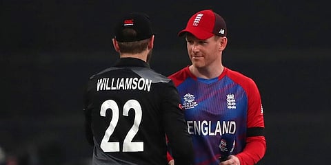 England's captain Eoin Morgan, right, greets New Zealand's captain Kane Williamson after the toss ahead of the ICC men's T20 World Cup semifinal match between their teams, Nov 10, 2021. (Photo | AP)