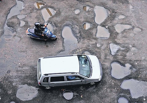 A road with potholes near Vyasarpadi Flyover in Chennai | DEBADATTA MALLICK