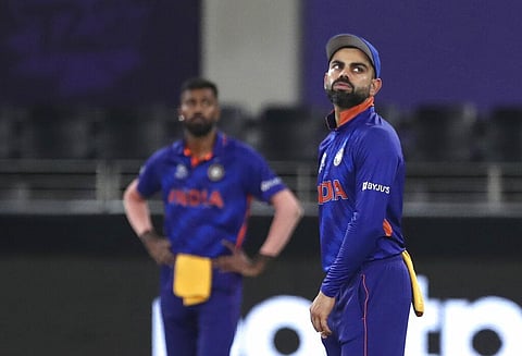 India's captain Virat Kohli reacts to a boundary hit by New Zealand's Daryl Mitchell during the Cricket Twenty20 World Cup match between New Zealand and India. (Photo | AP)