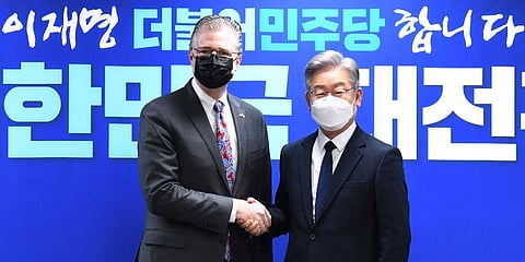 US Assistant Secretary of State for East Asian and Pacific Affairs Daniel J. Kritenbrink (L) shakes hands with South Korean Presidential candidate Lee Jae-myung in Seoul, South Korea. (Photo | AP)