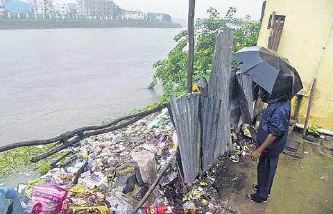 An iron sheet divides the Adyar river and the neighbourhood | r satish babu