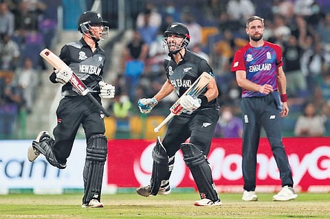 New Zealand batter Daryl Mitchell (centre) exults after scoring the winning-hit against England in Abu Dhabi | AFP